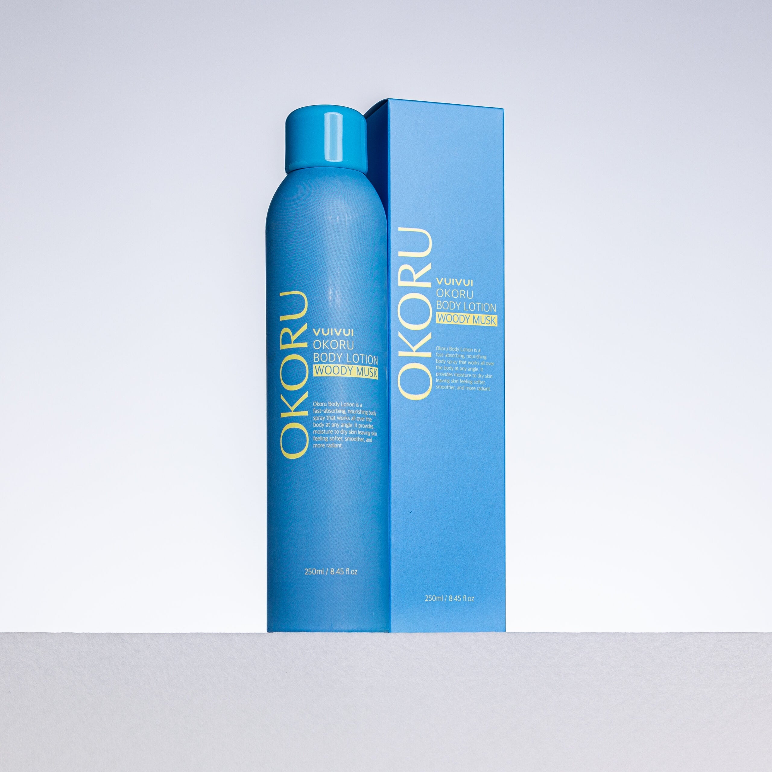 OKORU Woody Musk body lotion spray bottle close-up