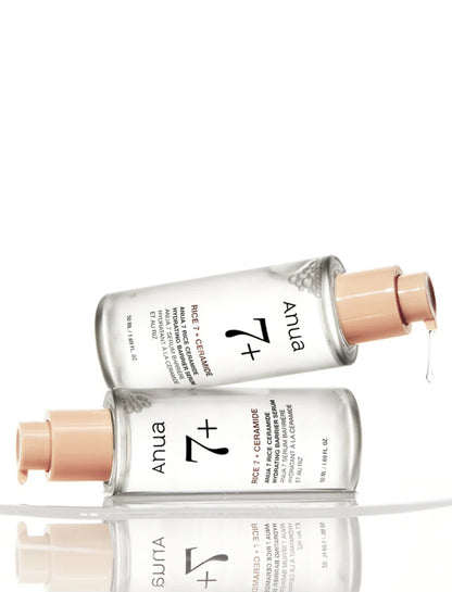 Anua Rice Ceramide 7 Hydrating Barrier Serum styled with rice grains