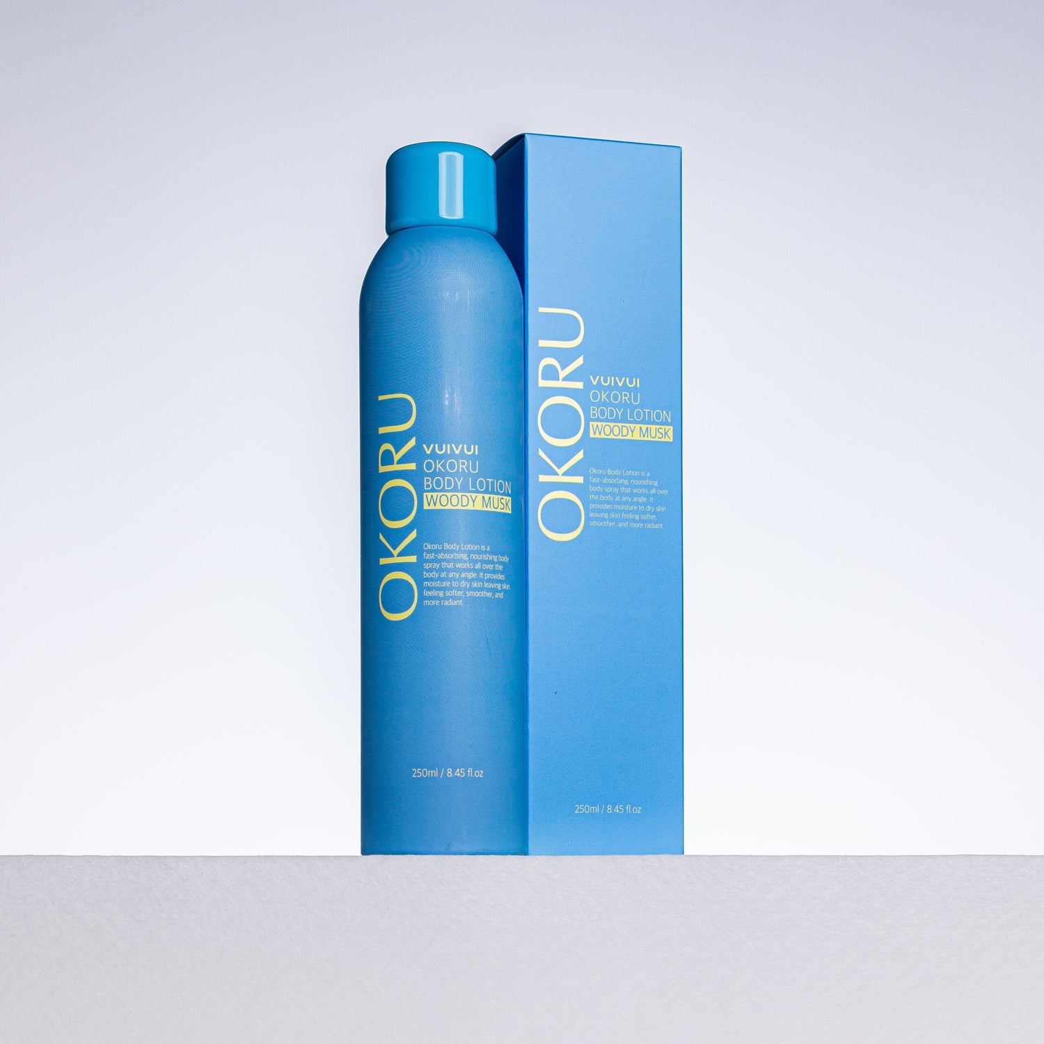 OKORU Woody Musk body lotion spray bottle close-up