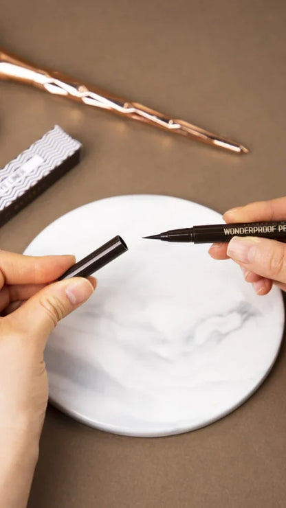 BOM Wonderproof Pen Eye Liner drawing a thin line along the lash line