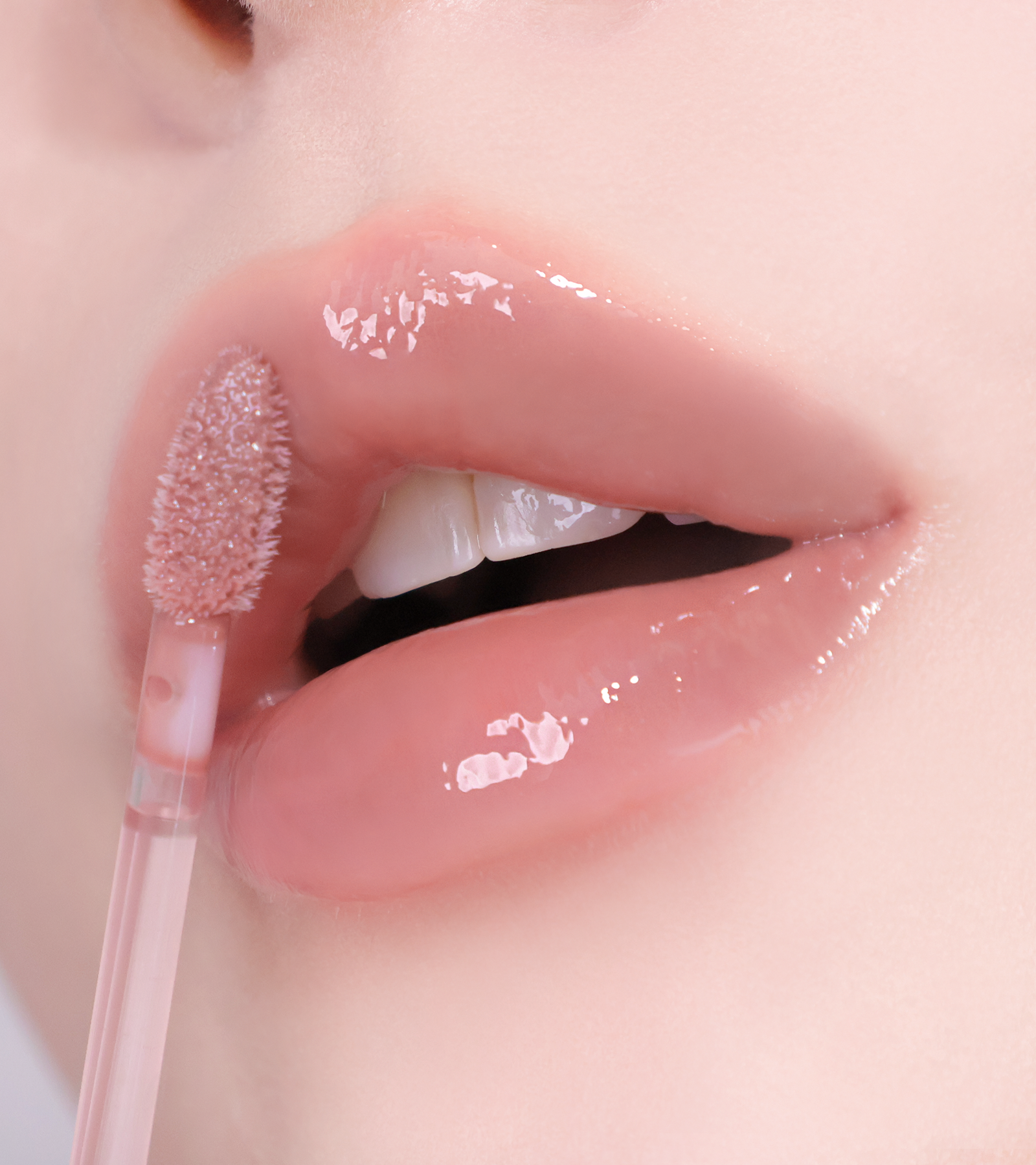 HUEMI Melting Glaze Lip Gloss showing glassy shine finish