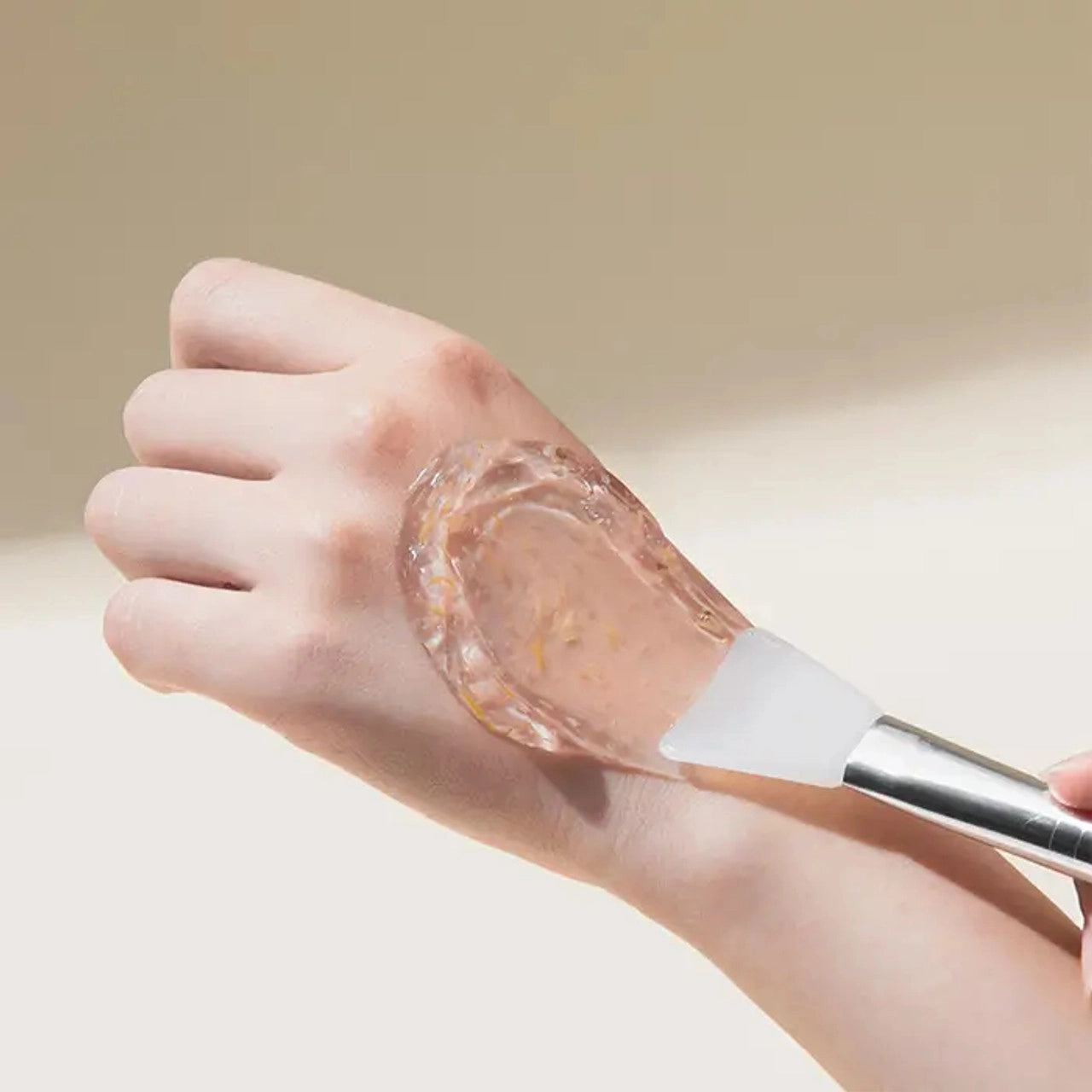 Woman applying Mary &amp; May Calendula Peptide Ageless Sleeping Mask to her face