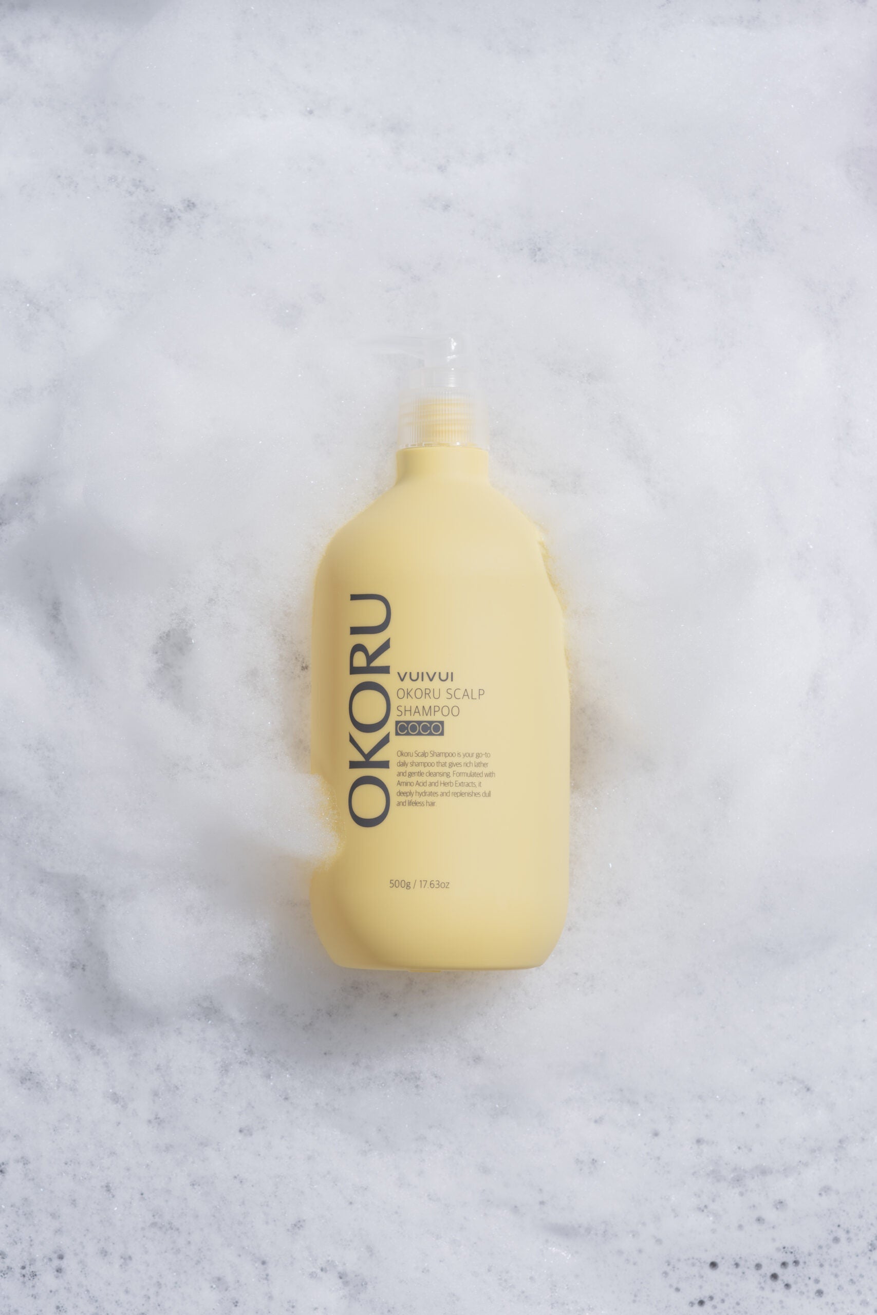 OKORU Scalp Shampoo Coco being applied to wet hair