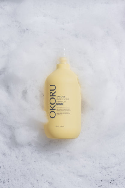OKORU Scalp Shampoo Coco being applied to wet hair